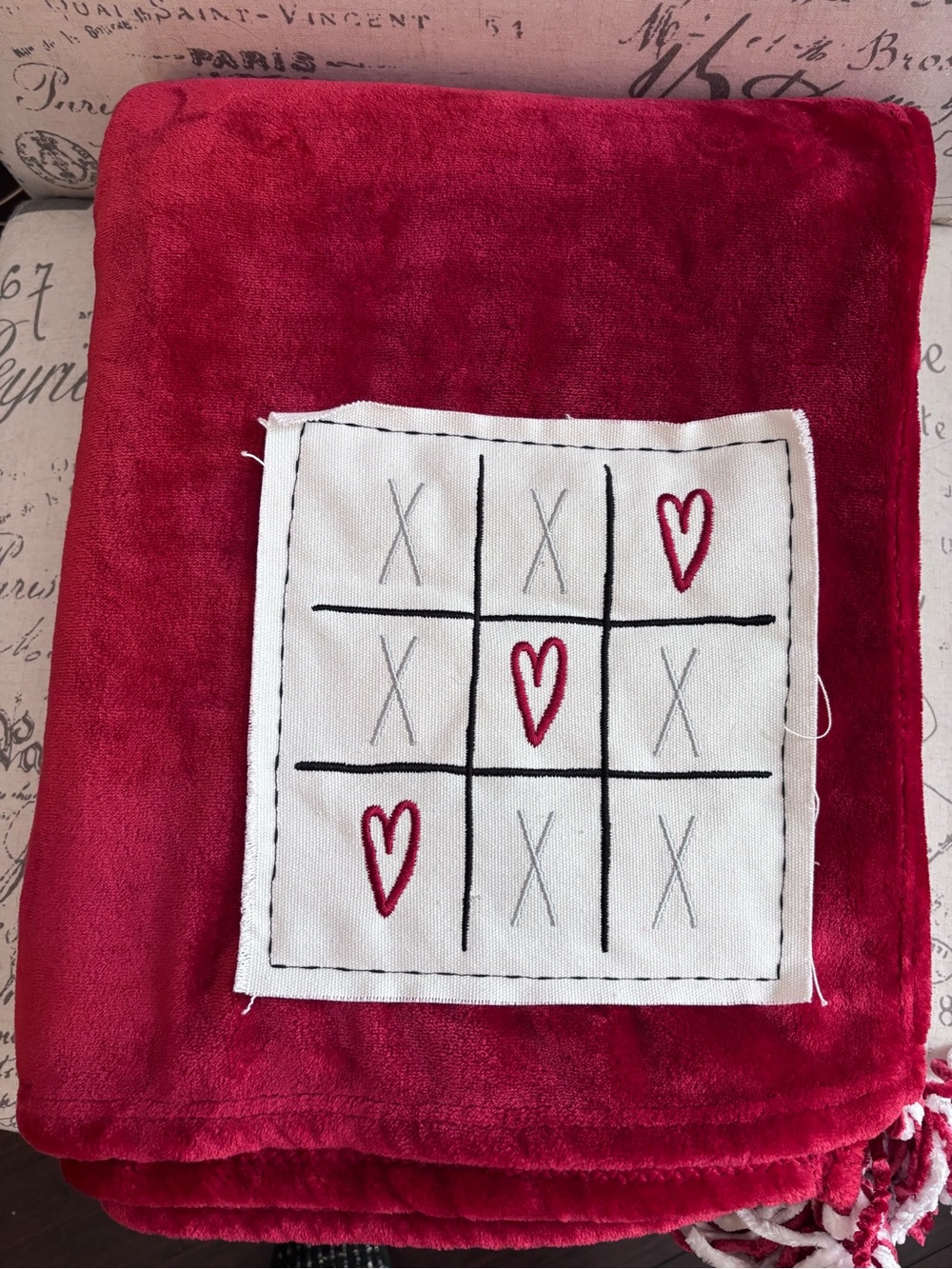 Rae Dunn Red Plush Throw Blanket with Embroidered Tic-Tac-Toe Patch with tassels